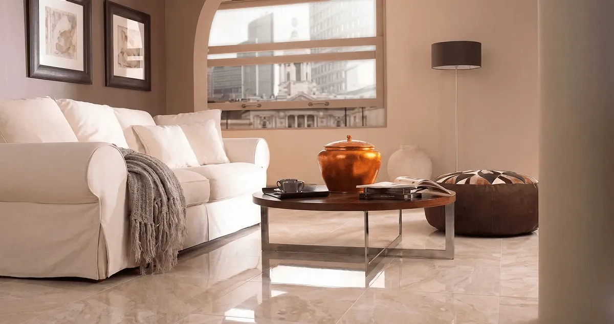 Modern living room with professionally installed marble flooring, a beige sofa, coffee table in Charlotte, NC