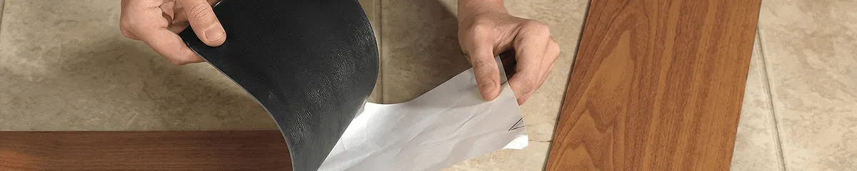 A professional installing vinyl flooring in Charlotte, NC